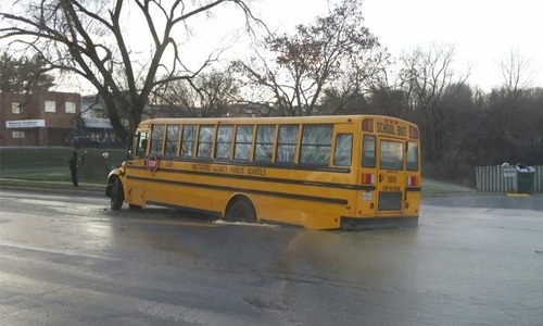 School bus stuck in sinkhole