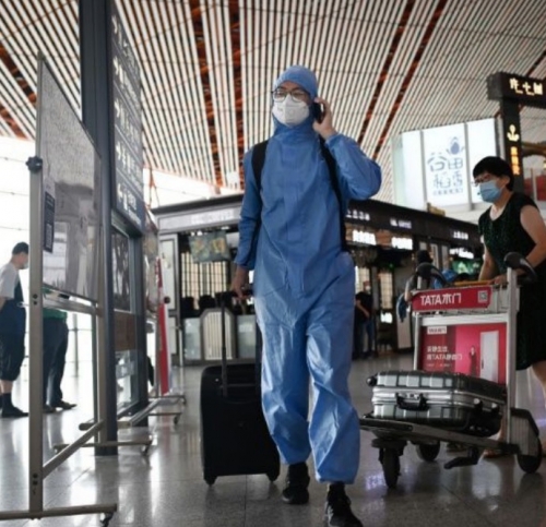 Beijing cancels flights, shuts schools over new outbreak
