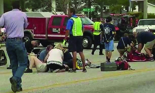 Car plows into Alabama Mardi Gras parade, injuring 12