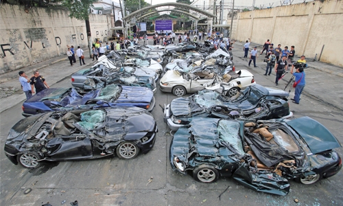 Philippines crushes  cars in graft warning