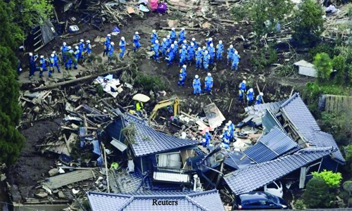 Rescuers race against landslides to reach Japan quake victims