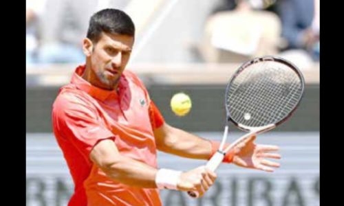 Djokovic battles into French Open second round Djokovic battles into French Open second round