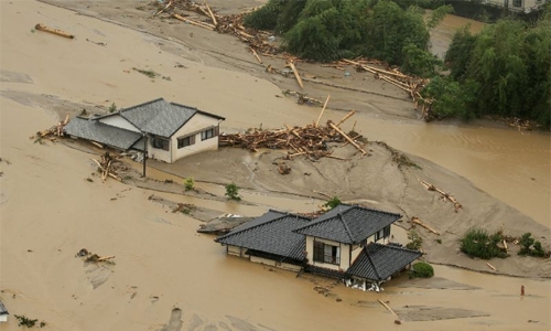 Huge floods sweep southern Japan, two dead, 18 missing