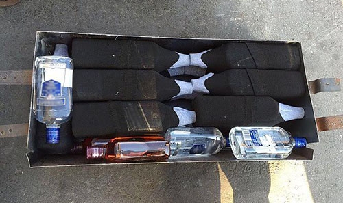 Attempt to smuggle 156 liqour bottles foiled