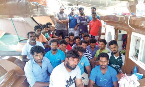 Indian fishermen languishing  in fishing boat in Kish Island