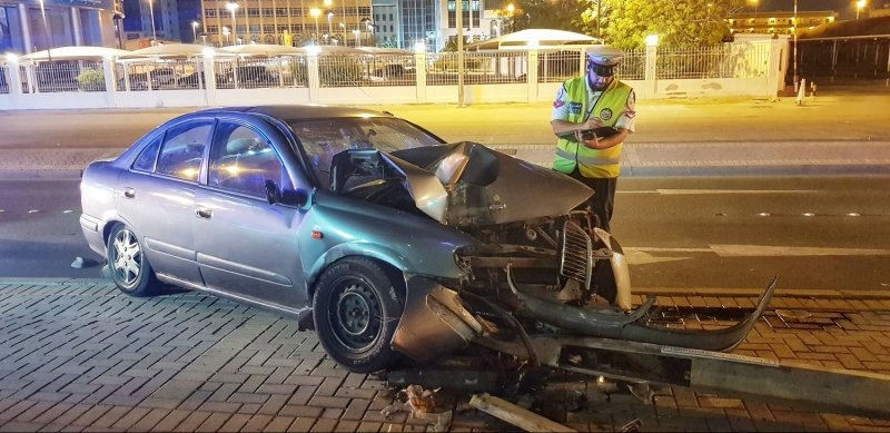 Wrong lane driver causes woman to ram into pole 