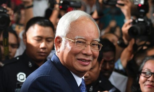 Malaysian ex-PM Najib's jail term halved to six years