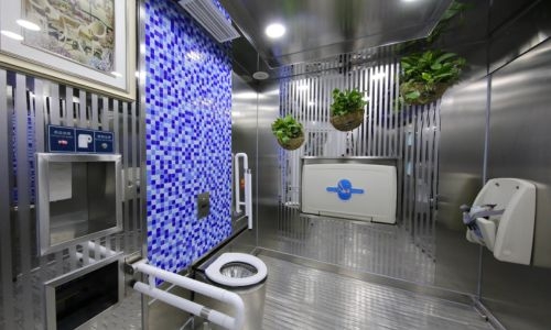 Should Bahrain airport consider replacing old toilets with smart, self-cleaning ones?