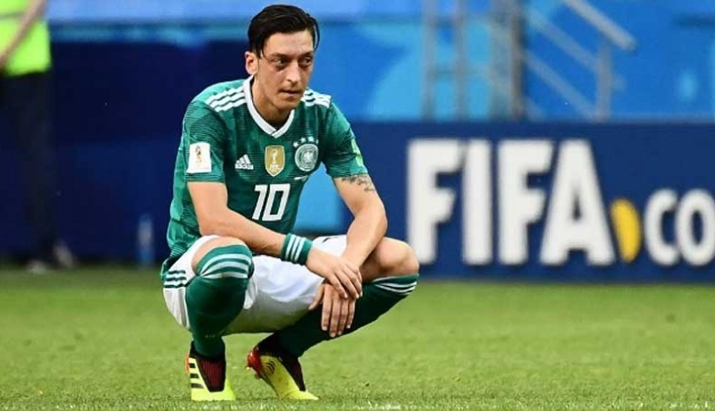 ‘Scapegoat’ Ozil should quit German team, says his father ‘Scapegoat’ Ozil should quit German team, says his father