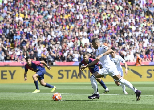 Barca stun Madrid in thriller
