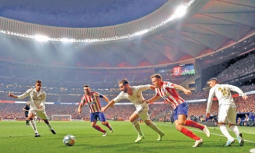 Real hold off Atletico 