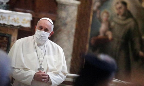 Pope wears mask for first time at public event