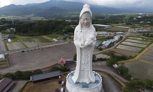 Giant Buddhist goddess in Japan gets face mask to pray for end of Covid-19