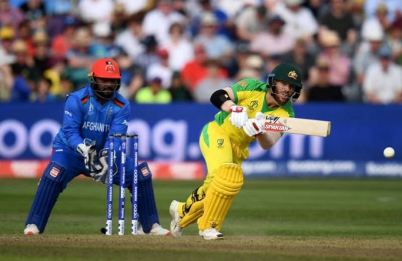 Australia’s Warner stars in Afghan World Cup romp Australia’s Warner stars in Afghan World Cup romp