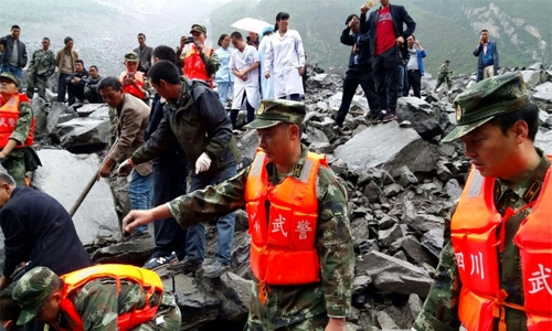 Hopes dim in search for 118 buried by China landslide Hopes dim in search for 118 buried by China landslide