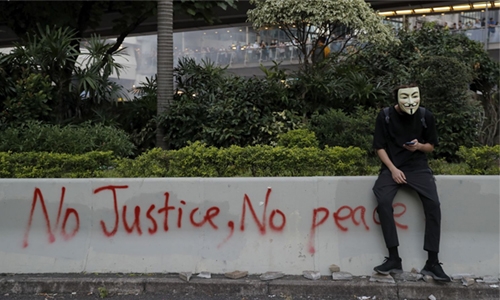 Clashes as Hong Kong invokes emergency powers to ban masks