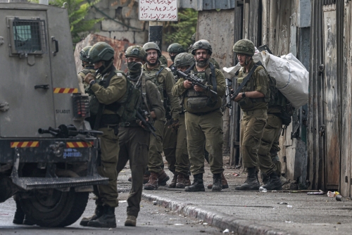 Israeli forces seize nearly $450,000 in West Bank raid