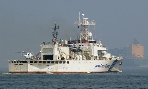 Japan searches for crew after navy helicopter accident