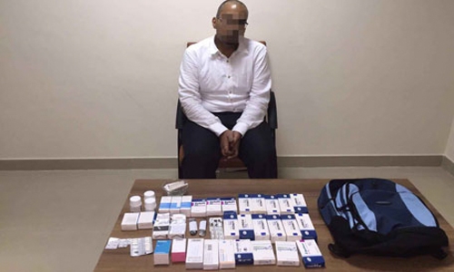 Pharmacist held with narcotic pills Pharmacist held with narcotic pills