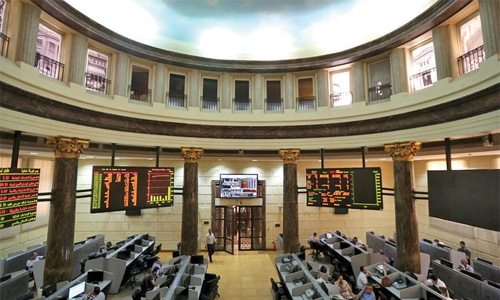 Qatar falls after Fitch downgrade, Qalaa helps Egypt