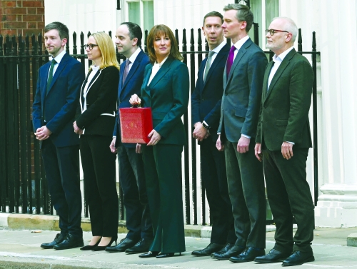 UK unveils tax-raising budget as growth downgraded