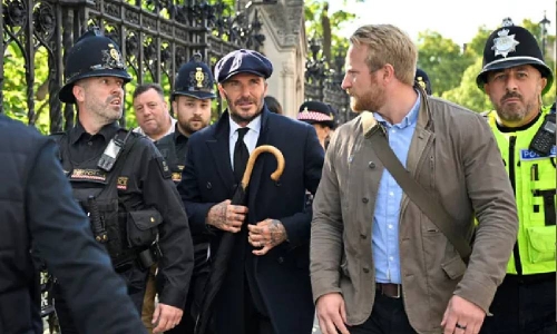 David Beckham queues through the night to see Queen's coffin 
