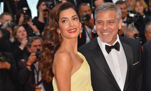 Clooney to sue Voici over images of twins Clooney to sue Voici over images of twins