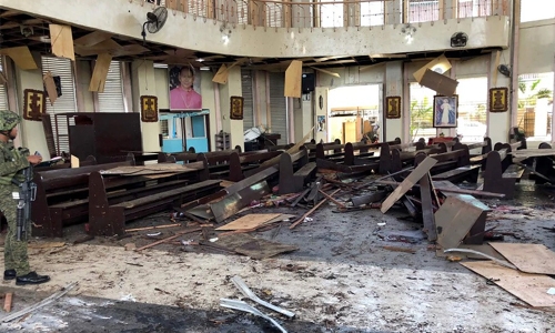 At least 18 killed in twin bomb attack on Philippine church