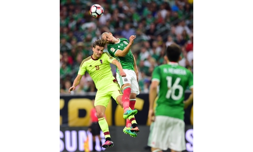 ‘Tecatito’ rescues Mexico