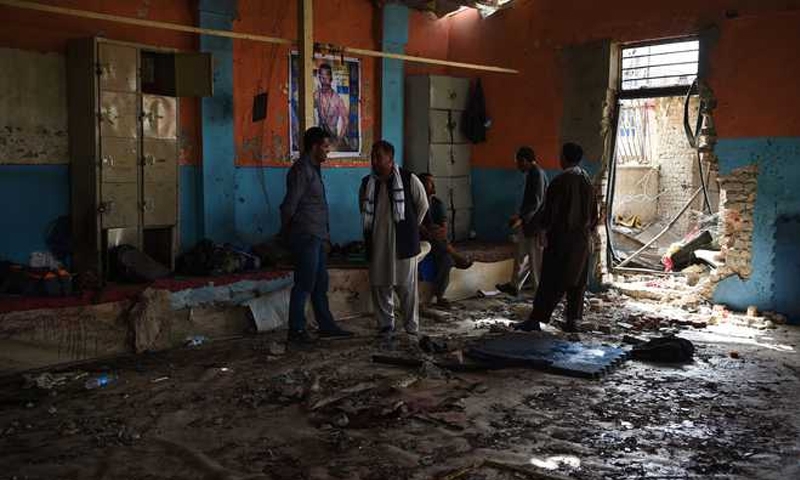 Twin blasts turn Kabul wrestling into massacre