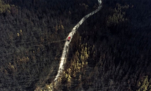 Planes dump water on Siberian wildfires as residents plead for help