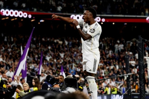 Vinicius double helps Real Madrid edge Atletico thriller