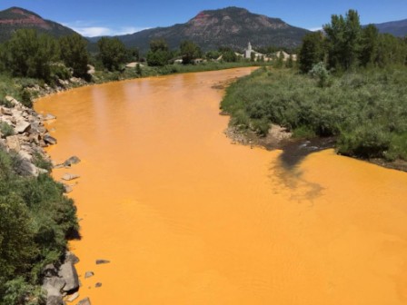 US anti-pollution workers turn river orange in toxic spill