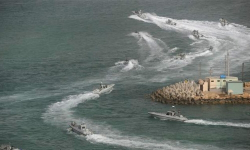 Iran warned U.S. warship to leave drill area Iran warned U.S. warship to leave drill area