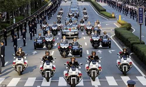 Japan’s new emperor holds rare parade