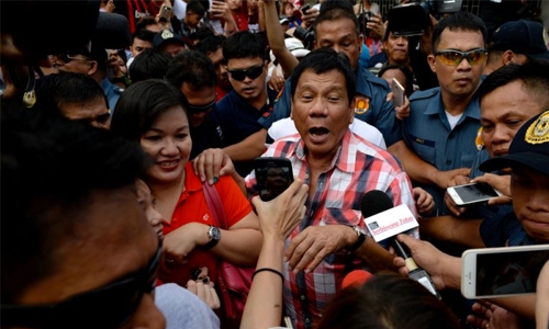 Hundreds on Philippine streets as Duterte jails top critic