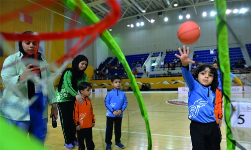 Excited kids take part in basketball free throws 
