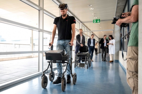 Paralysed man walks again via thought-controlled implants