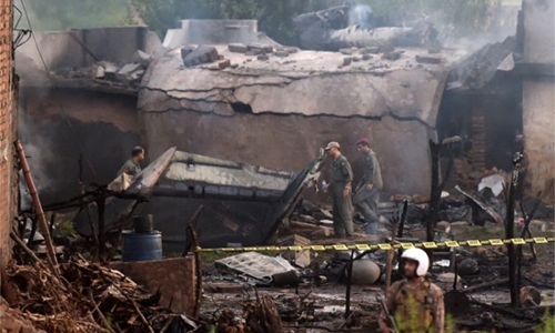 18 killed as Pakistan army plane crashes into residential area 18 killed as Pakistan army plane crashes into residential area
