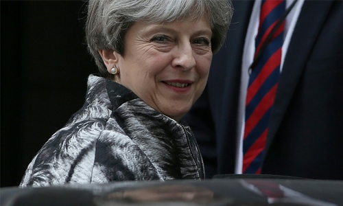 Britain's May apologises to own MPs for election 'mess'