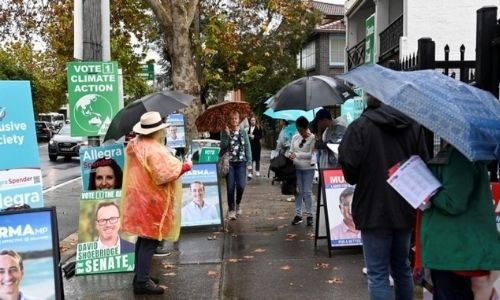 Australian voters head to polls in close-run election