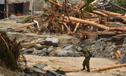 Rescuers scramble to find missing after Japan floods