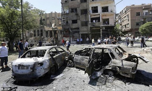 18 killed as car bombers strike Damascus 18 killed as car bombers strike Damascus