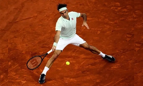 Federer saves two match points to beat Monfils