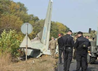 Ukraine leader praises crash survivor as toll climbs to 26