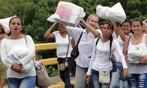 Venezuelans storm border with Colombia to stock up Venezuelans storm border with Colombia to stock up