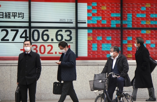 Most Asian markets rise but traders worry over looming rate hikes