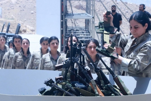 Kurdish PKK fighters destroy weapons at key ceremony Kurdish PKK fighters destroy weapons at key ceremony