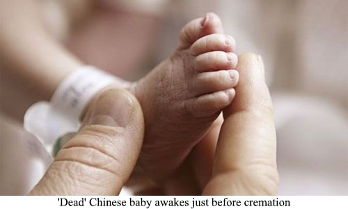 'Dead' Chinese baby awakes just before cremation 'Dead' Chinese baby awakes just before cremation