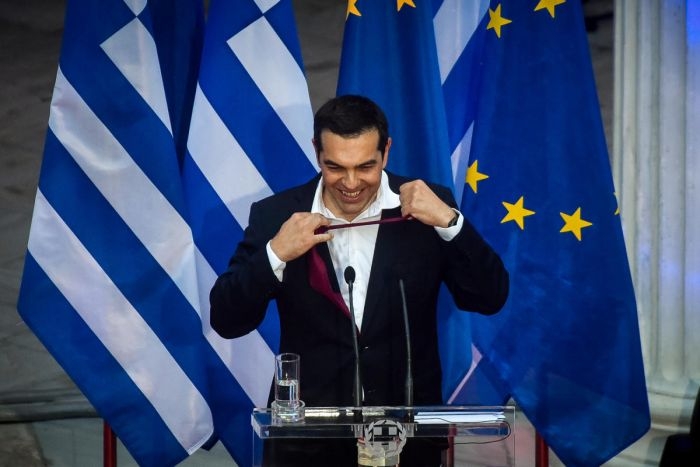 Greece Prime Minister wears a neck tie as promised he would after settling the country’s debt issues 